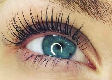 Close-up of blue eye with lush lashes at House Of Envy Longford, Gloucester, England, GB.