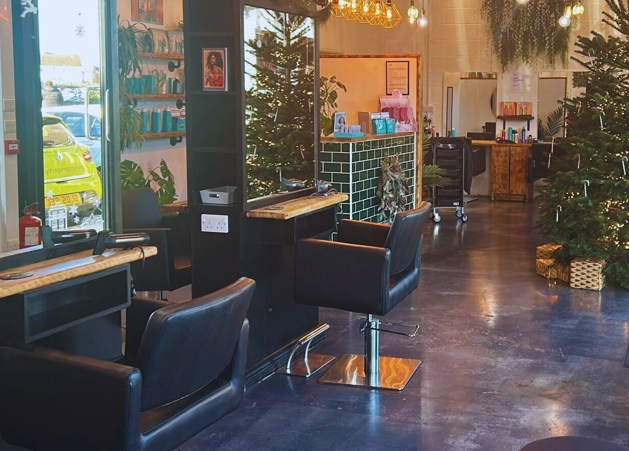 House Of Envy Longford salon with chic decorations in Gloucester, England, GB, featuring elegant styling chairs.