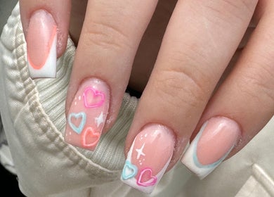 Heart-themed nail art at Wings of Beauty, Leeds, England, GB.