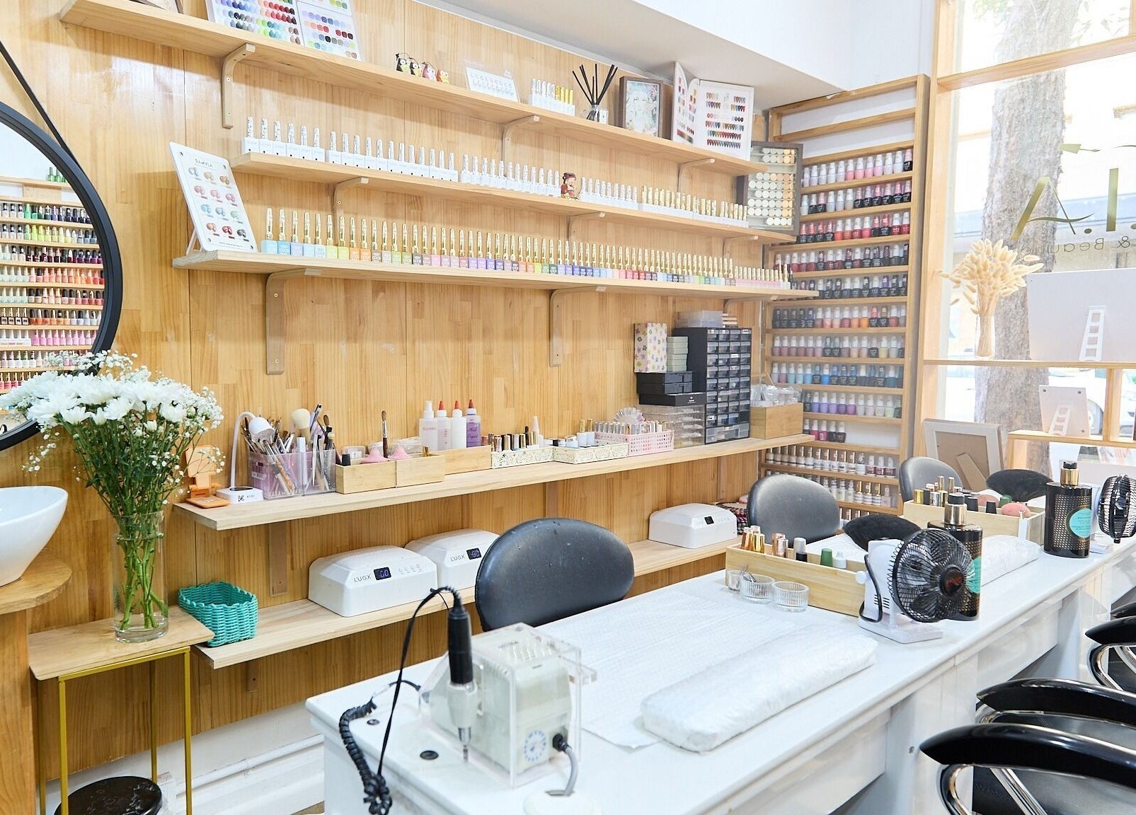 MIA Nails & Beauties salon in Darlinghurst, NSW, AU showcasing stylish nail stations and colorful polishes.