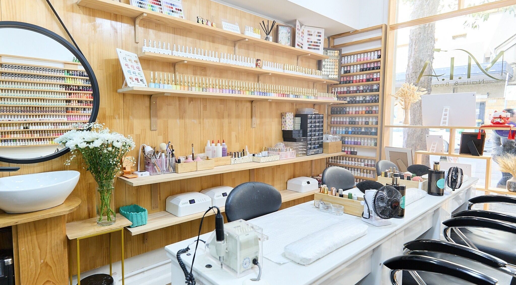 MIA Nails & Beauties salon in Darlinghurst, NSW, AU showcasing stylish nail stations and colorful polishes.