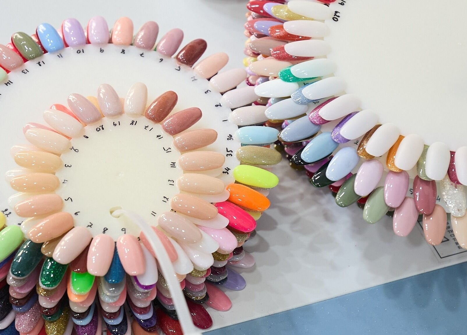 Colorful nail sample palette at MIA Nails & Beauties in Darlinghurst, NSW, AU showcases diverse nail art options.