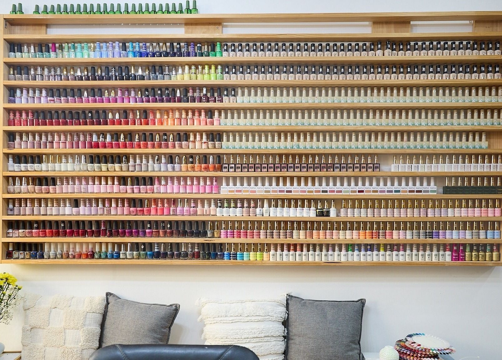 Vibrant nail polish display at MIA Nails & Beauties, Darlinghurst, NSW, AU, showcasing extensive color options.