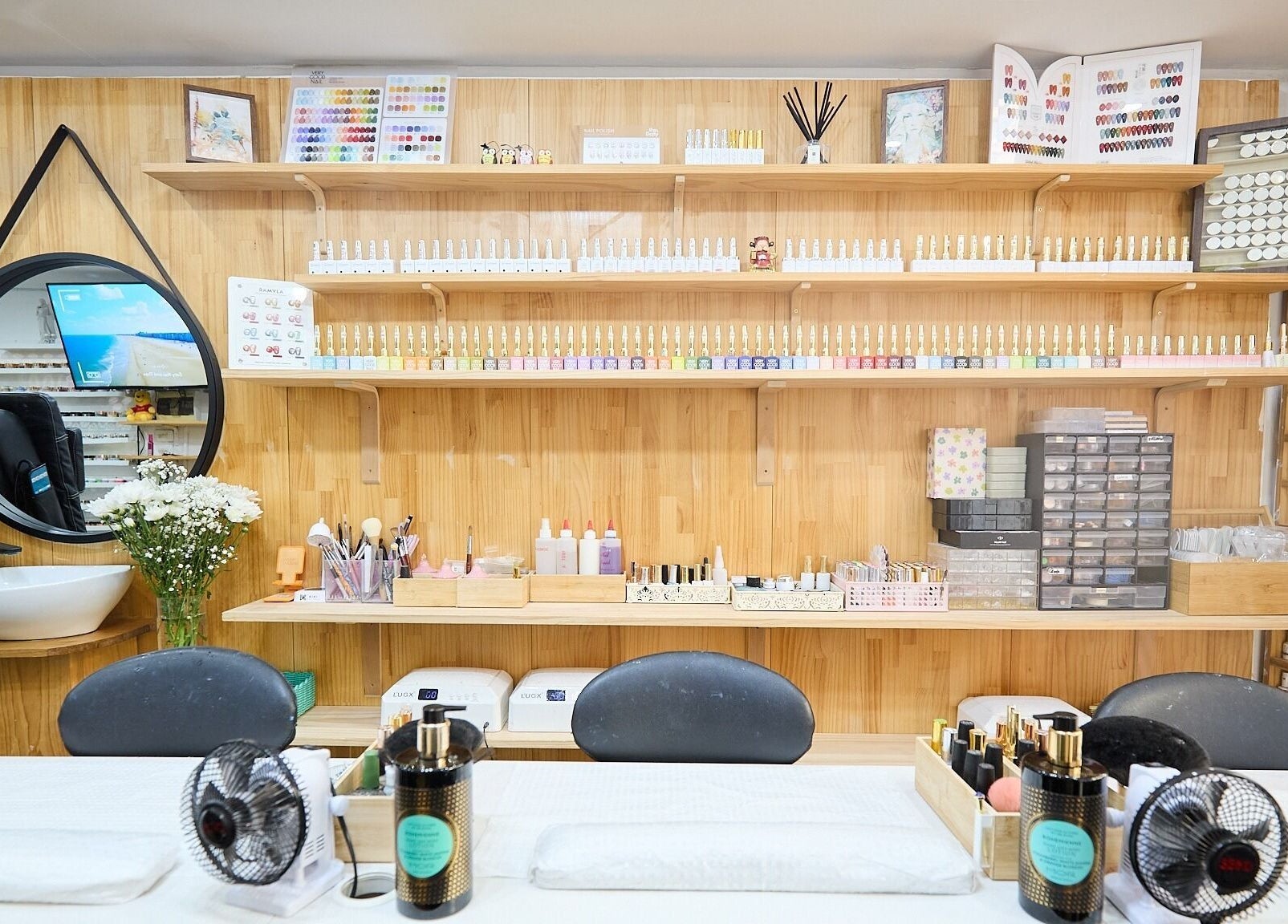 Nail polish display at MIA Nails & Beauties in Darlinghurst, NSW, AU, featuring a modern, organized setup.