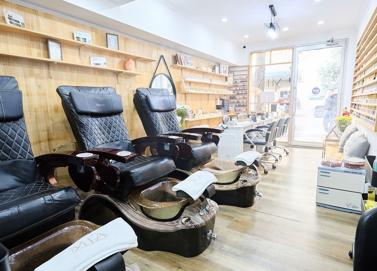 Spacious and elegant salon interior at MIA Nails & Beauties, Darlinghurst, NSW, AU featuring luxury pedicure chairs.