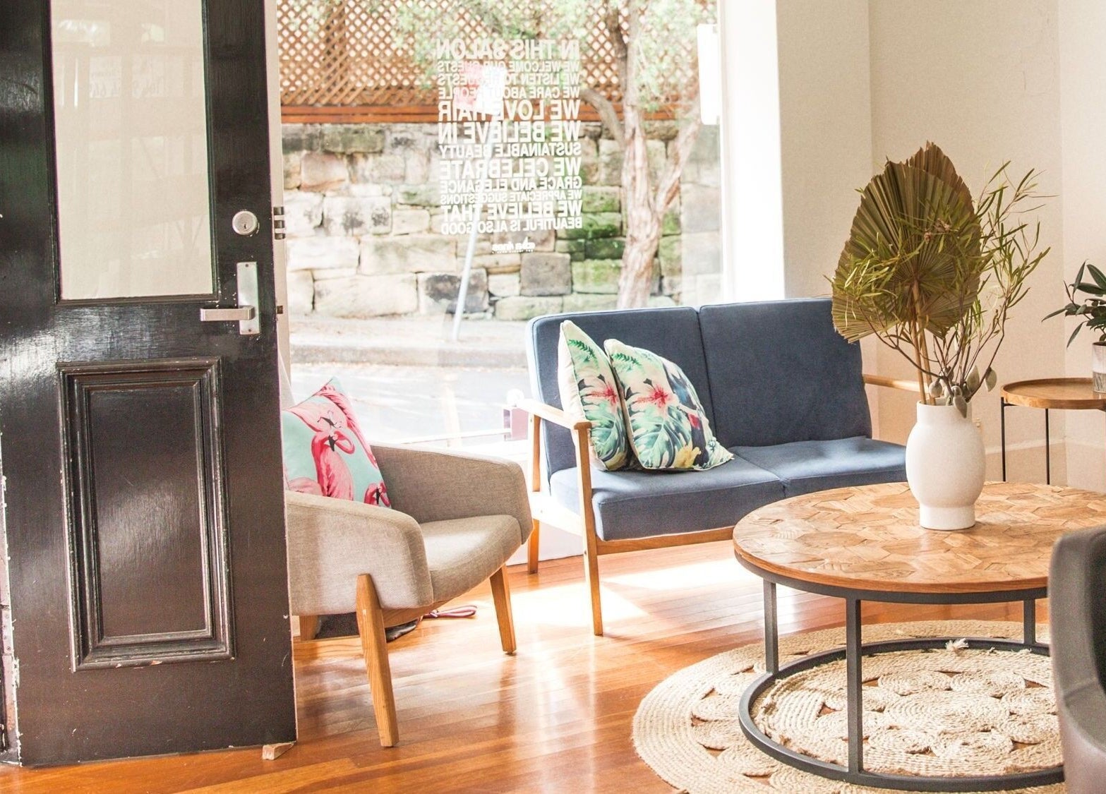 Cozy waiting area at Sessions Hairdressing in Mcmahons Point, New South Wales, AU with stylish decor.