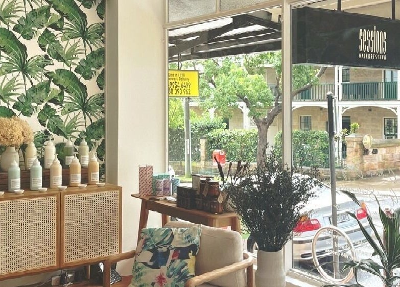Sessions Hairdressing interior with tropical decor in Mcmahons Point, New South Wales, AU.