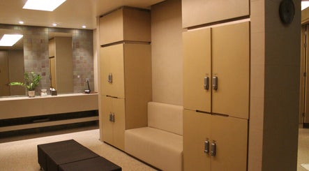 Tranquil locker room at Namm Spa, Dubai, Dubai, AE, showcasing sleek design and relaxing ambiance.