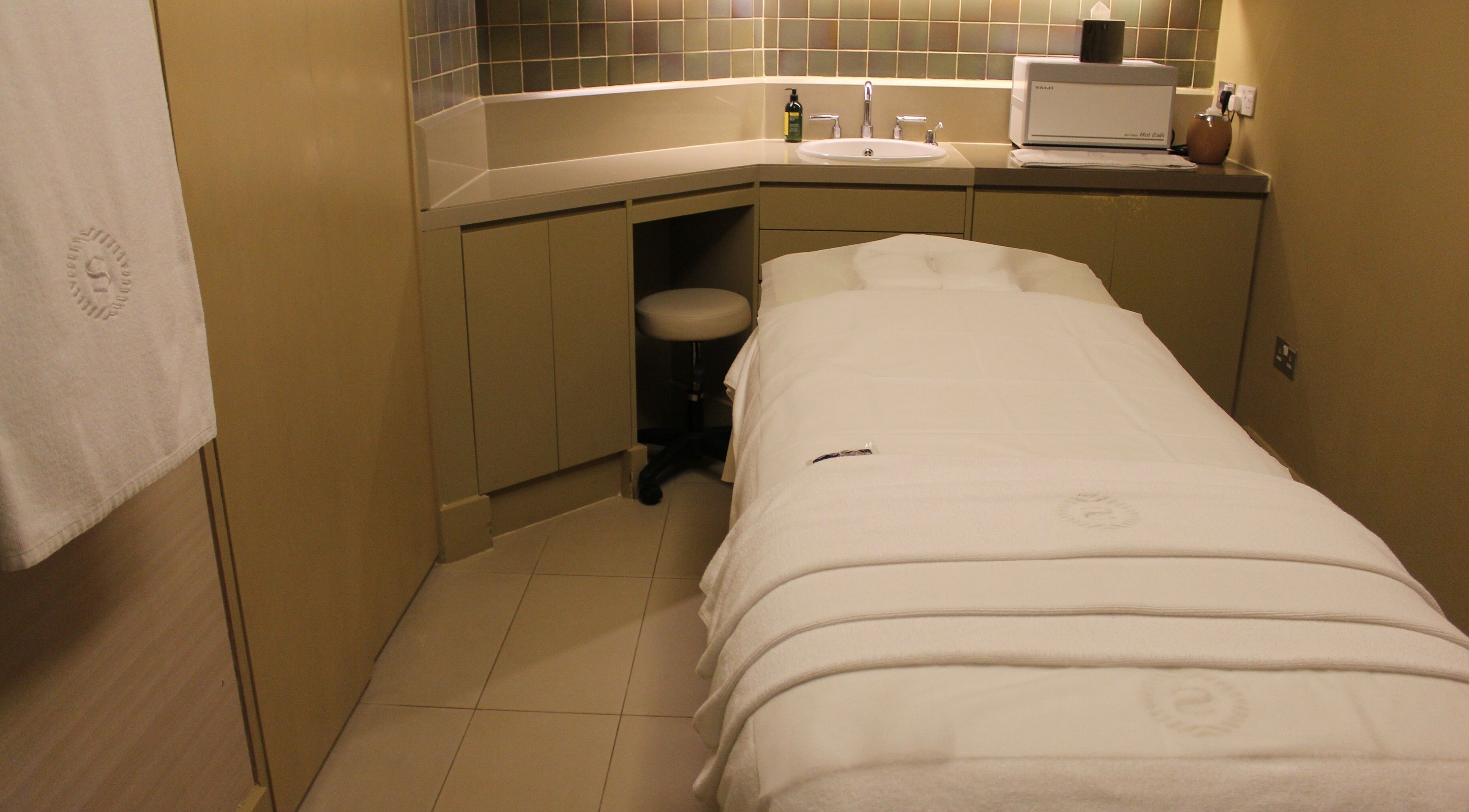 Relaxing massage room at Namm Spa, Dubai, Dubai, AE, showcasing a treatment bed with cozy linens.