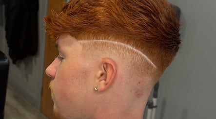 Close-up of a stylish copper haircut with fade by Tylerthebarber in Antrim, Northern Ireland, GB.