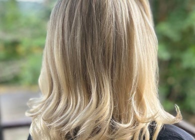 Beautiful blonde hairstyle at Hair by Ellie, Sidmouth, England, GB, showcasing elegant waves.
