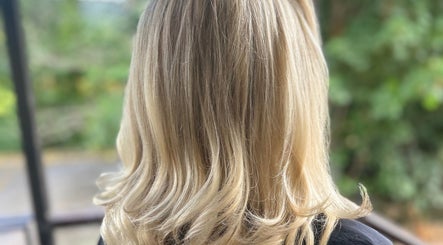 Beautiful blonde hairstyle at Hair by Ellie, Sidmouth, England, GB, showcasing elegant waves.