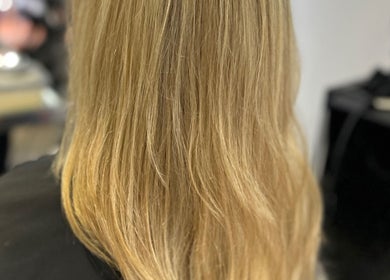 Blonde hair styled at Hair by Ellie, Sidmouth, England, GB. Sleek and shiny look.