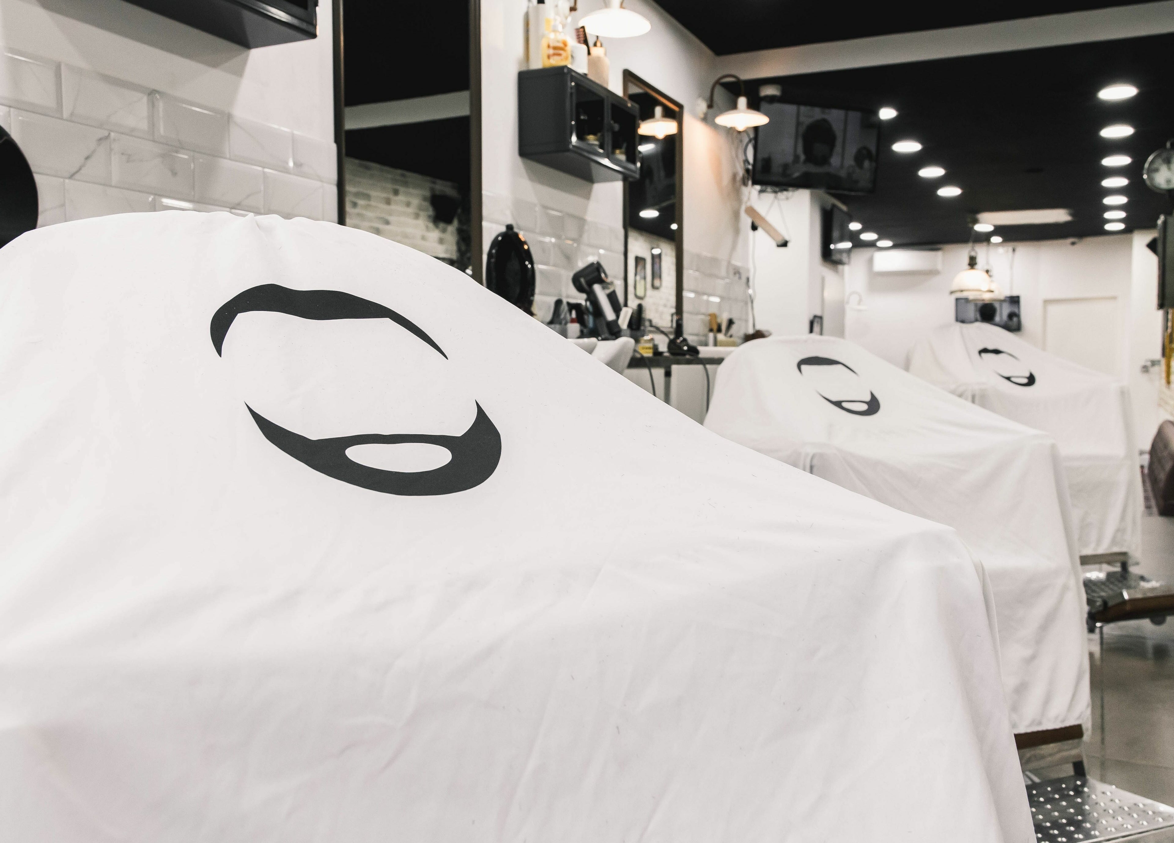 Stylish interior of Strak Strak - Barbershop in Rotterdam, South Holland, NL, showcasing modern barber chairs.