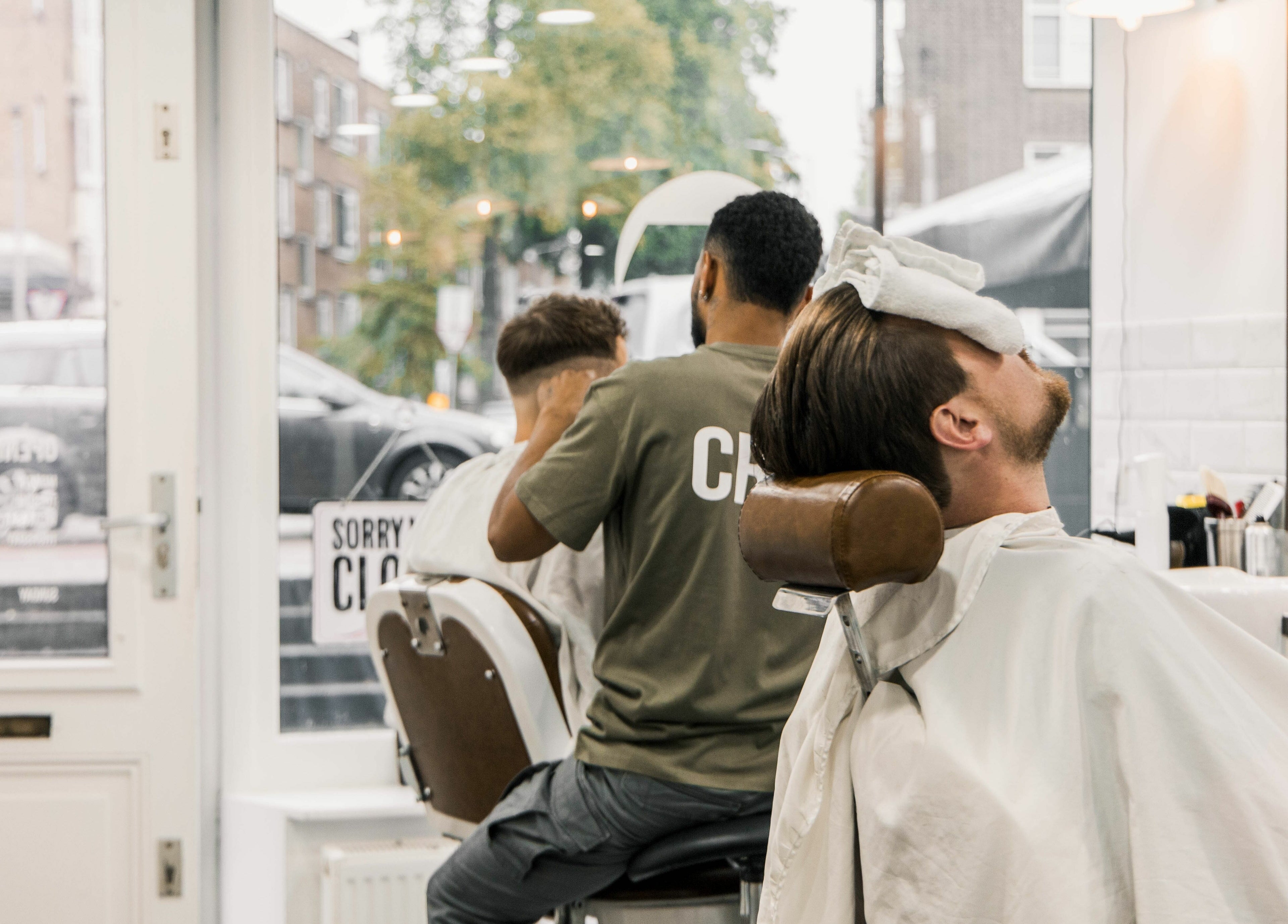 Clients enjoying grooming at Strak Strak - Barbershop, Rotterdam, South Holland, NL.