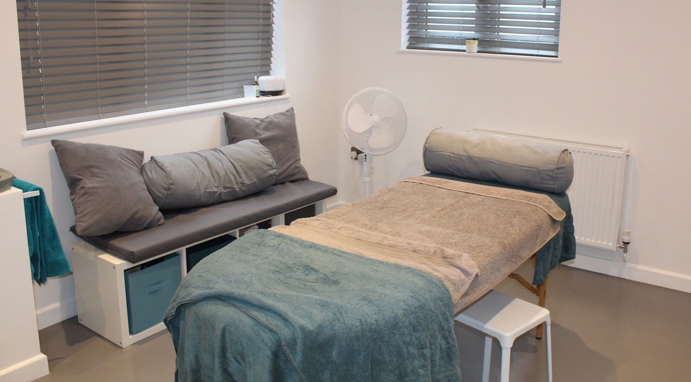 Calm treatment room at Valkyrie Performance and Aesthetics in Norwich, England, GB, featuring a cozy massage bed.