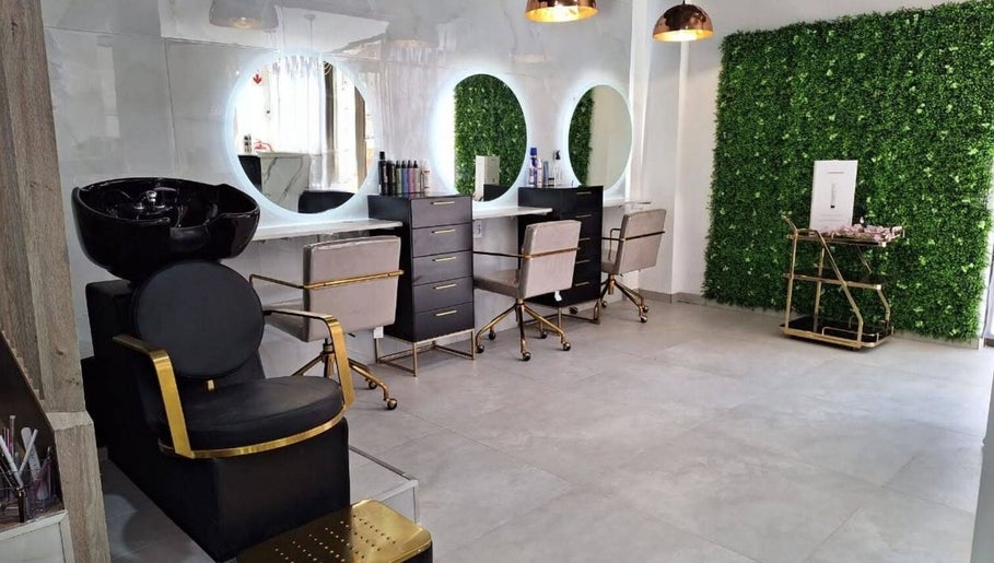 Stylish salon interior at The Glam Lounge, Berea, Kwazulu-natal, ZA with modern decor and sleek styling stations.