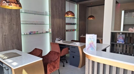 Modern nail area at The Glam Lounge, Berea, Kwazulu-natal, ZA. Elegant seating with polished decor and nail products.