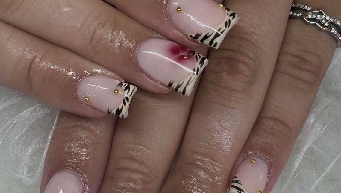 Elegant zebra and floral nail art at Nailsbysoph Xox, Ruthin, Wales, GB.
