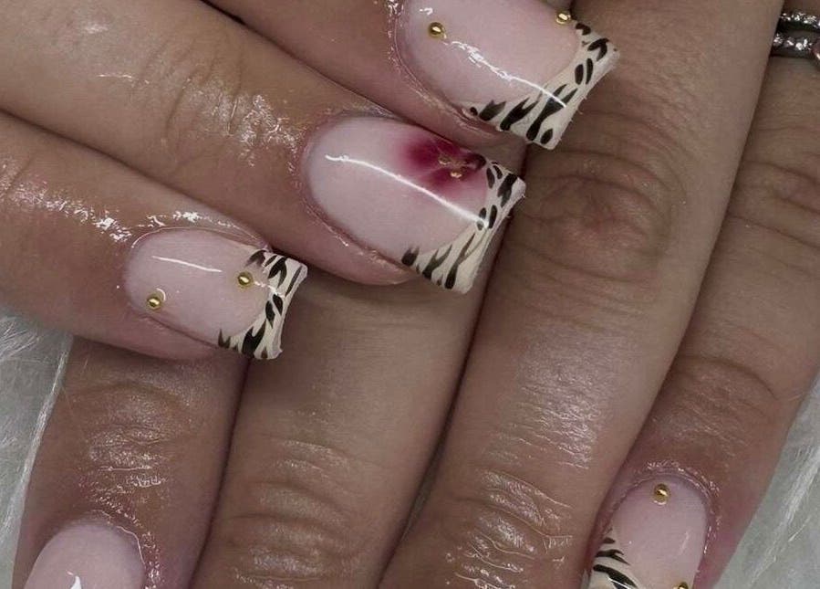Elegant zebra and floral nail art at Nailsbysoph Xox, Ruthin, Wales, GB.