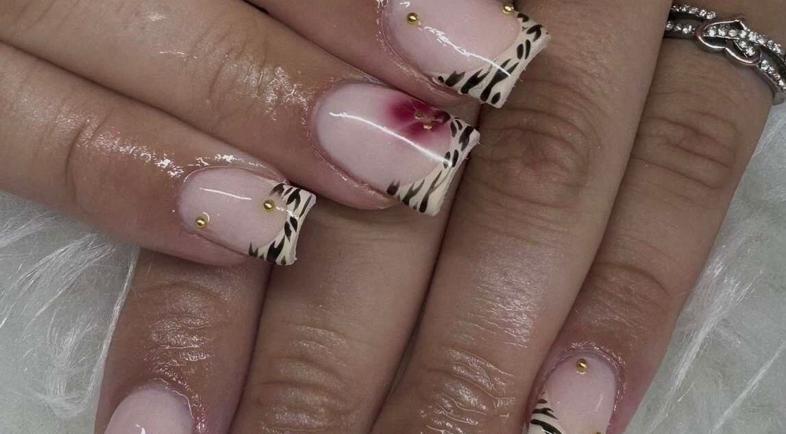 Elegant zebra and floral nail art at Nailsbysoph Xox, Ruthin, Wales, GB.