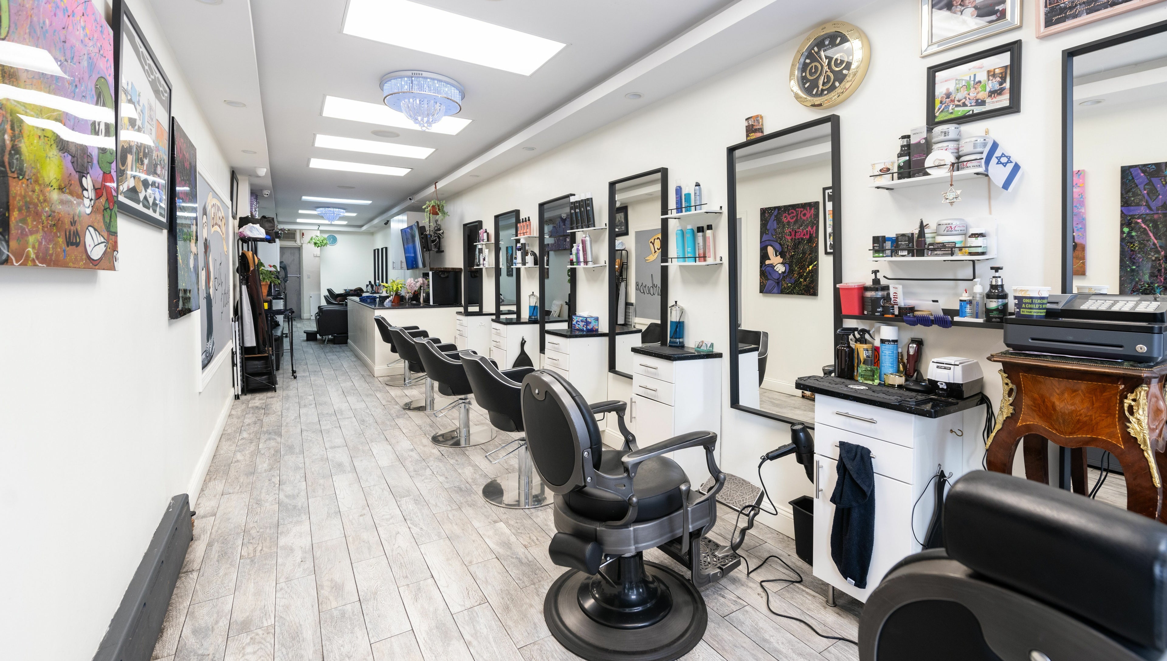 Modern interior of Balayage Studio in New York, New York, US, showcasing elegant styling stations.