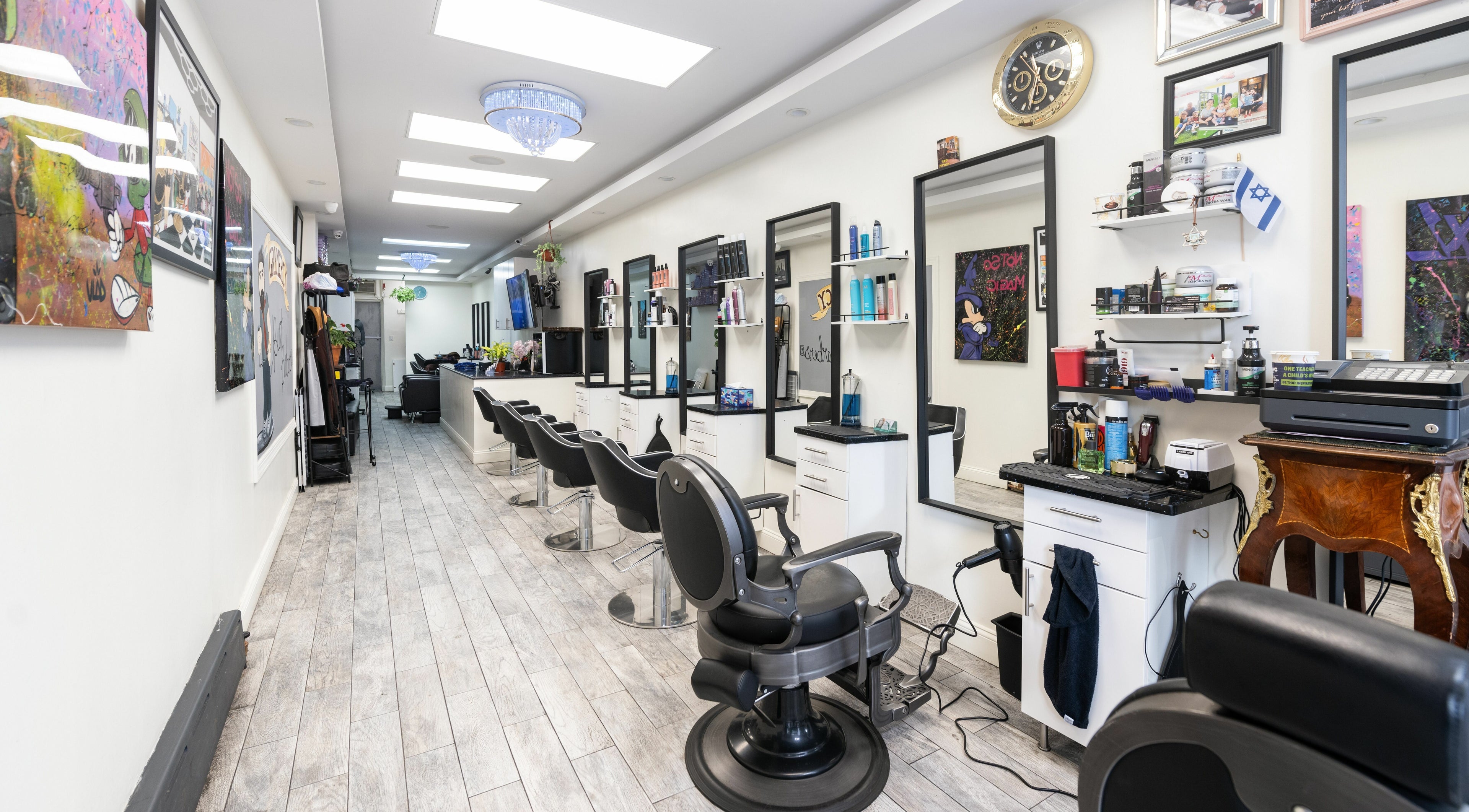Modern interior of Balayage Studio in New York, New York, US, showcasing elegant styling stations.