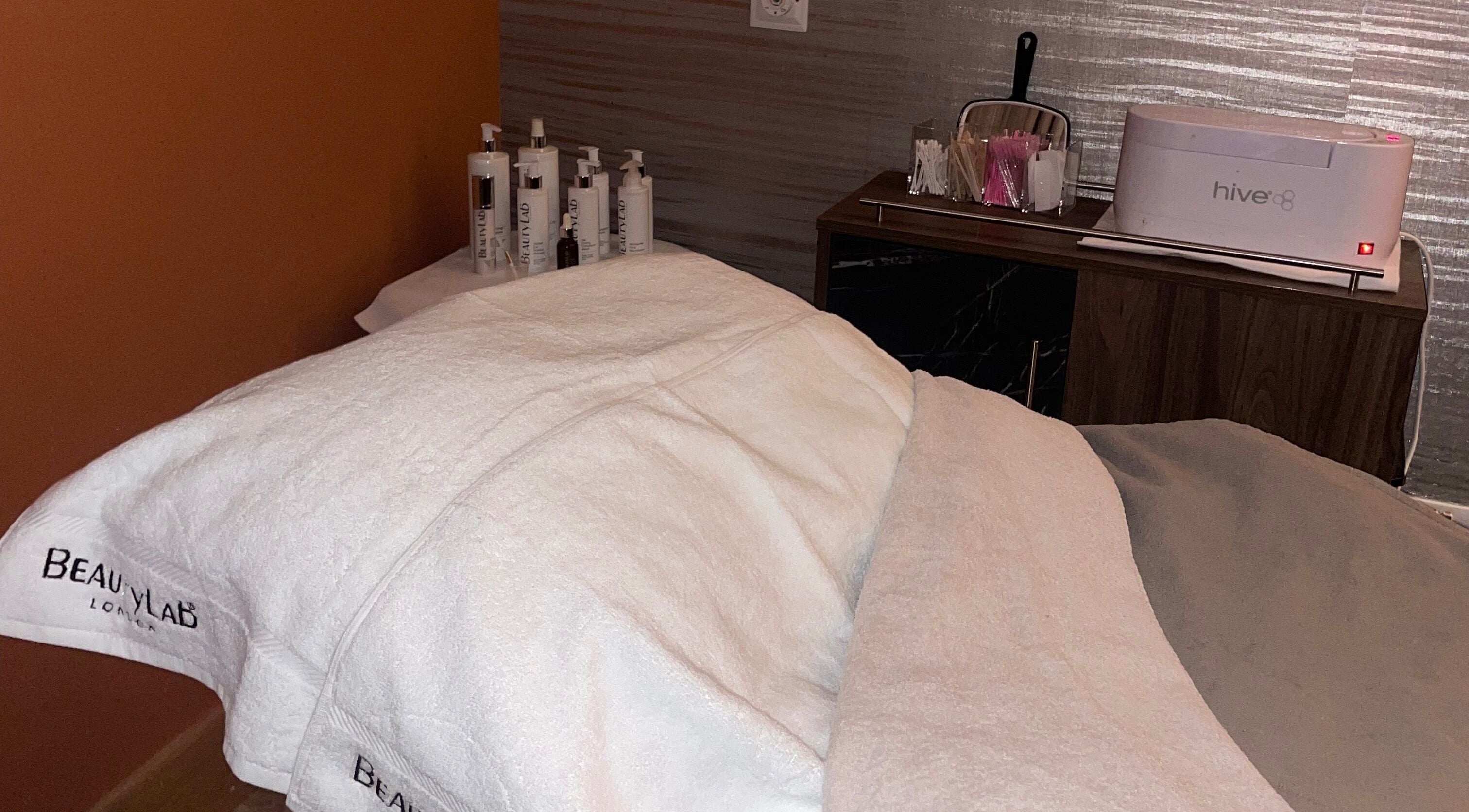 Relaxing treatment table at Beauty by Aneesah, Park, Scotland, GB with luxury skincare products.