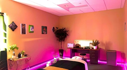 Relaxing massage room at Ashley's Healing Massage in Fort Lauderdale, Florida, US with tranquil lighting and decor.