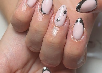 Stylish nail art with metallic tips at HT Collective, Dronfield, England, GB offering chic beauty services.
