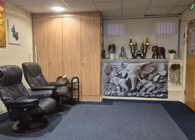 Relaxing lounge with elephant decor at U Sabai Massage & Spa, Newport, Wales, GB, inviting for tranquil wellness.