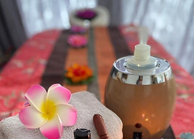 Relaxing spa setup with flowers and oils at U Sabai Massage & Spa, Newport, Wales, GB.