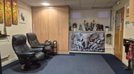 Relaxing massage chairs at U Sabai Massage & Spa, Newport, Wales, GB, enhancing serene ambiance.
