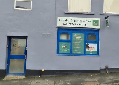 Exterior of U Sabai Massage & Spa in Newport, Wales, GB, showcasing entrance and massage therapy signs.