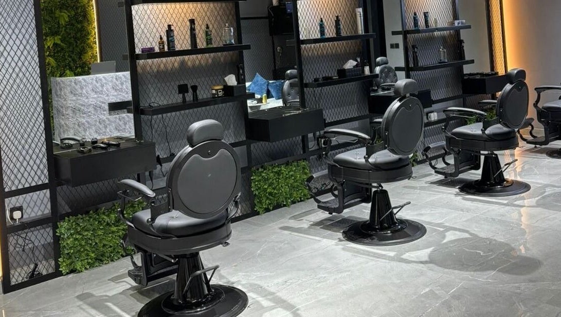 Interior view of Fade Oclock Barbershop in Dubai, Dubai, AE showcasing sleek barber chairs and stylish decor.