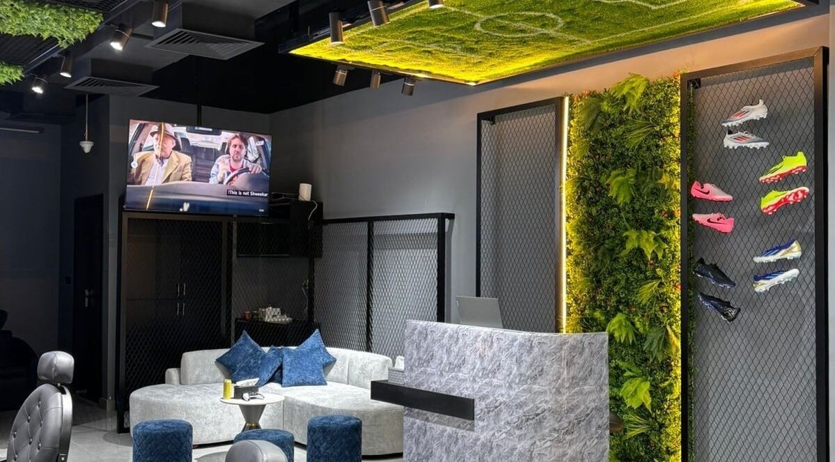 Contemporary lounge area at Fade Oclock Barbershop, Dubai, Dubai, AE featuring modern decor and seating.