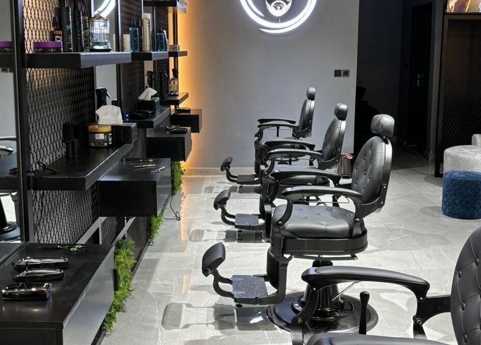 Chic barber chairs and modern decor at Fade Oclock Barbershop in Dubai, Dubai, AE showcasing sophisticated setup.