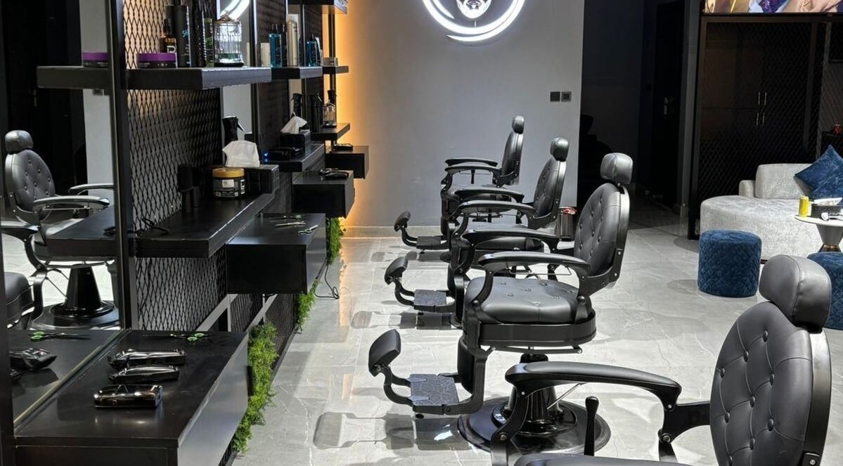 Chic barber chairs and modern decor at Fade Oclock Barbershop in Dubai, Dubai, AE showcasing sophisticated setup.