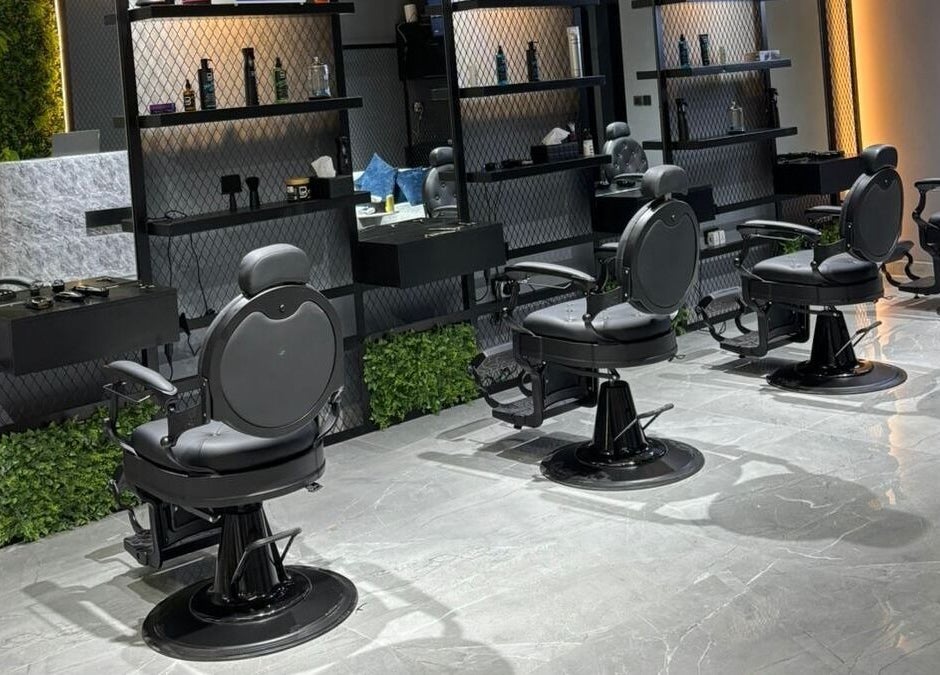 Modern interior of Fade Oclock Barbershop, featuring sleek barber chairs, Dubai, Dubai, AE.