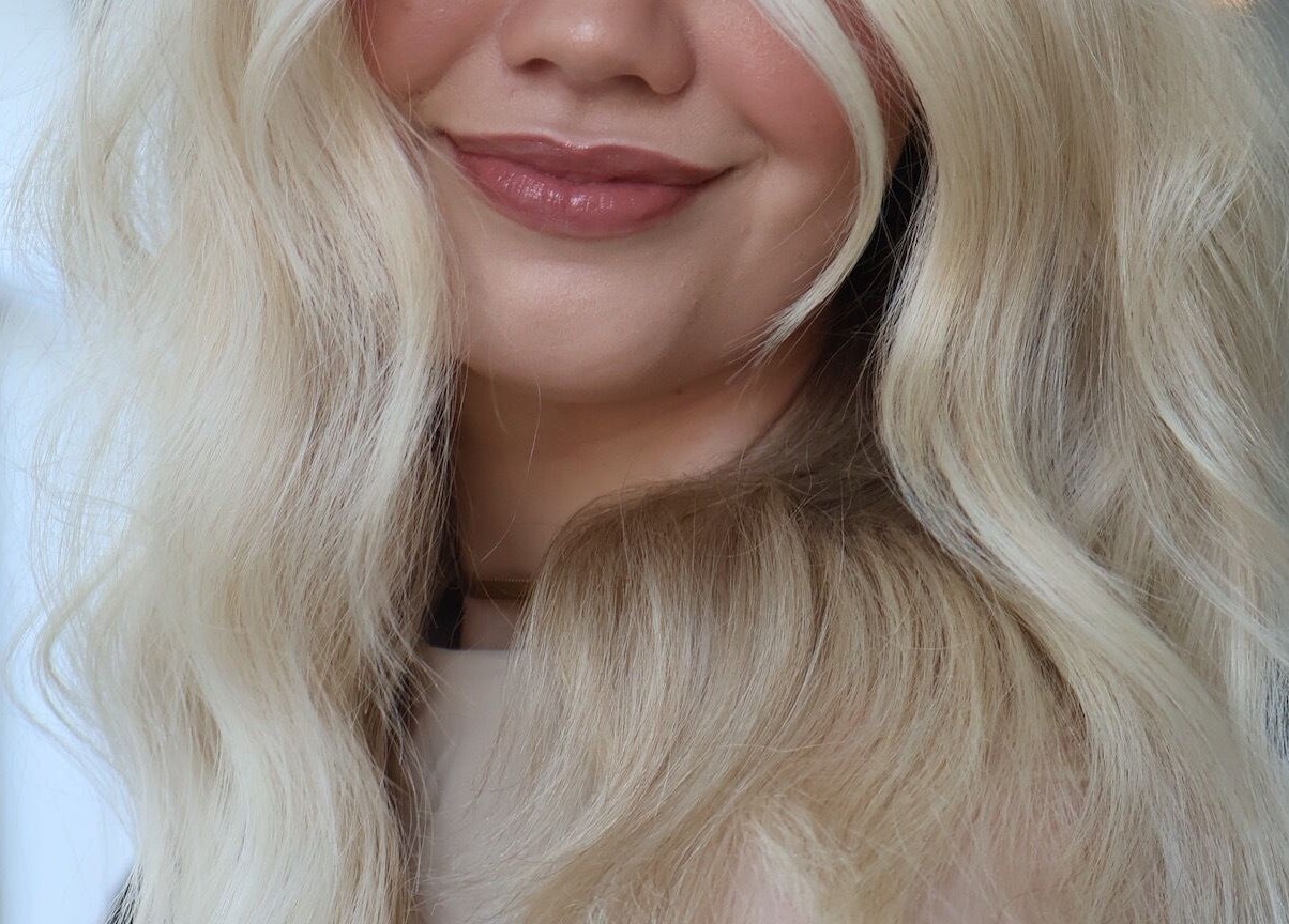 Blonde wavy hairstyle at KEIRAVILLE THE SALON in Keiraville, New South Wales, AU.