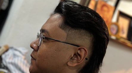 Modern hairstyle at Offcut Club, Singapore, SG showcasing sleek, undercut design.