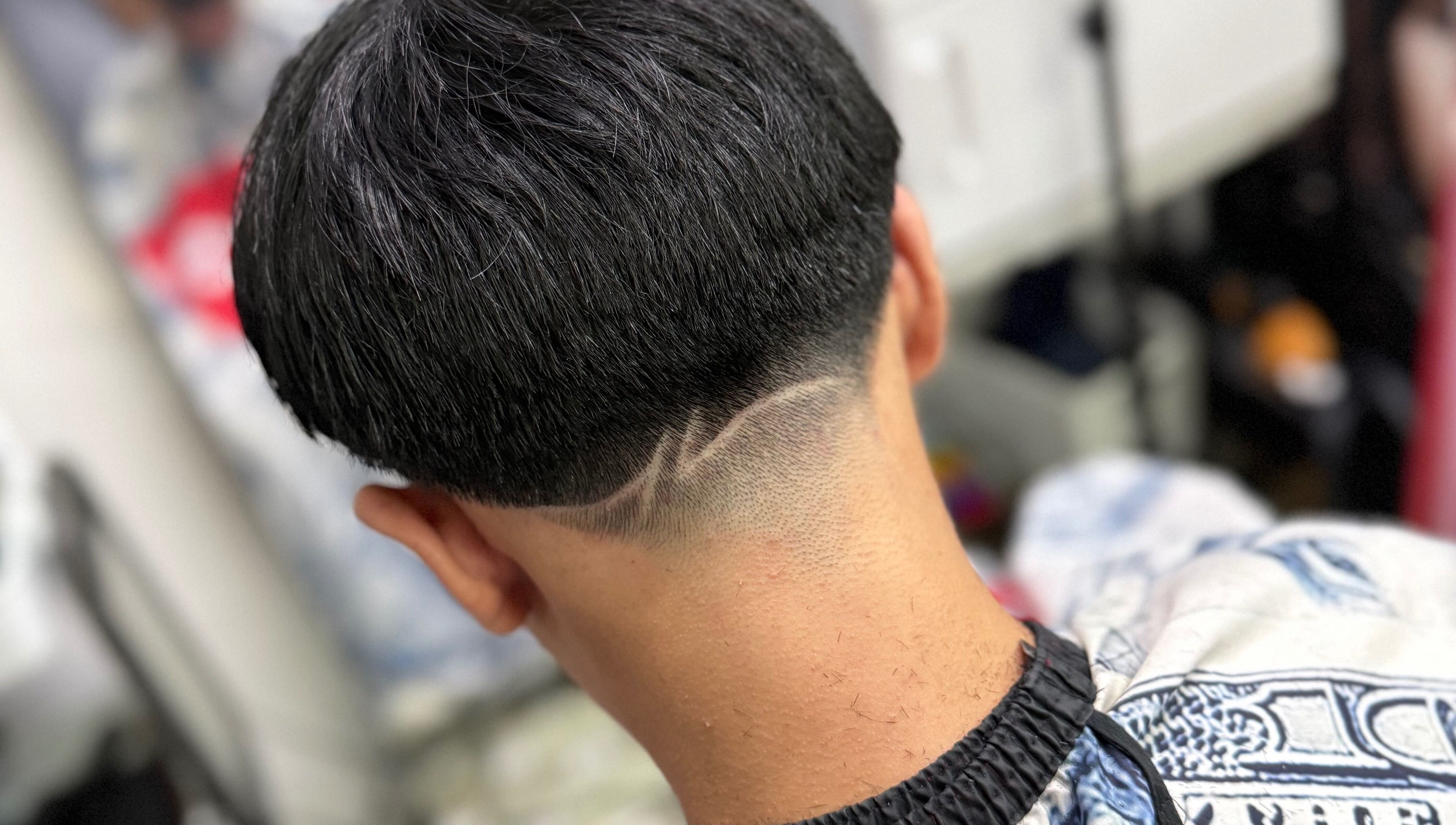 Close-up of a trendy undercut hairstyle at Offcut Club, Singapore, Singapore, SG, showcasing modern grooming.