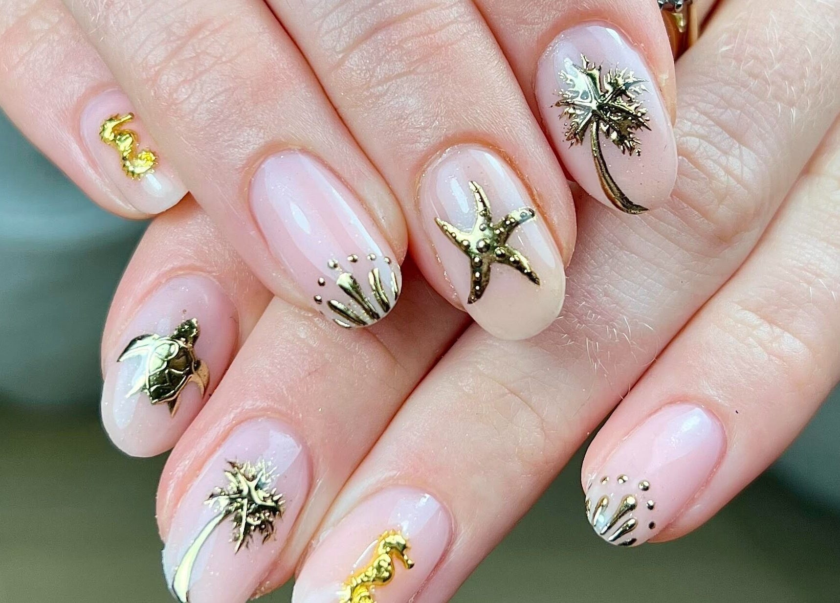 Detailed ocean-themed nail art at Megs Manicures, Abbots Leigh, England, GB, featuring starfish and seaweed.