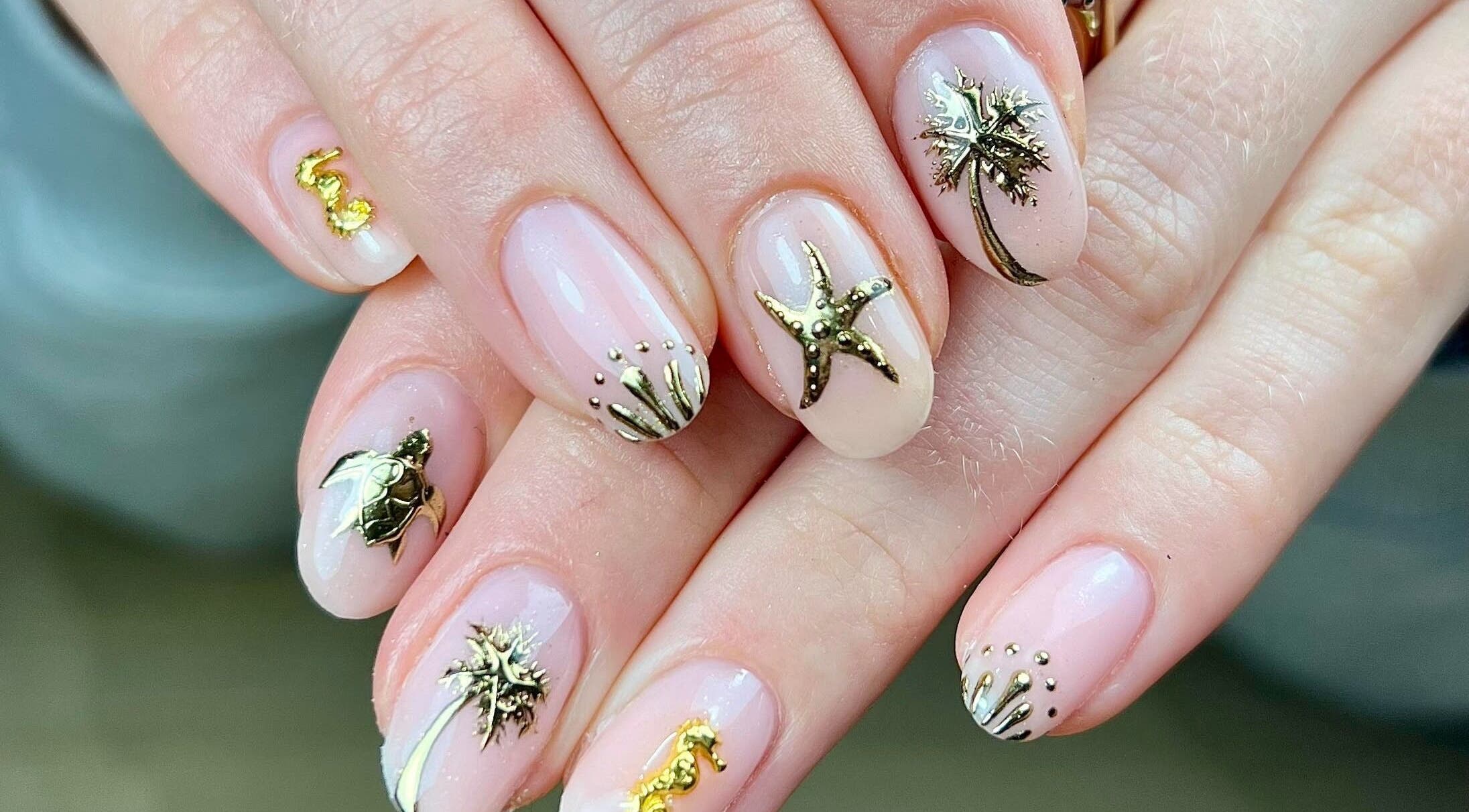 Detailed ocean-themed nail art at Megs Manicures, Abbots Leigh, England, GB, featuring starfish and seaweed.