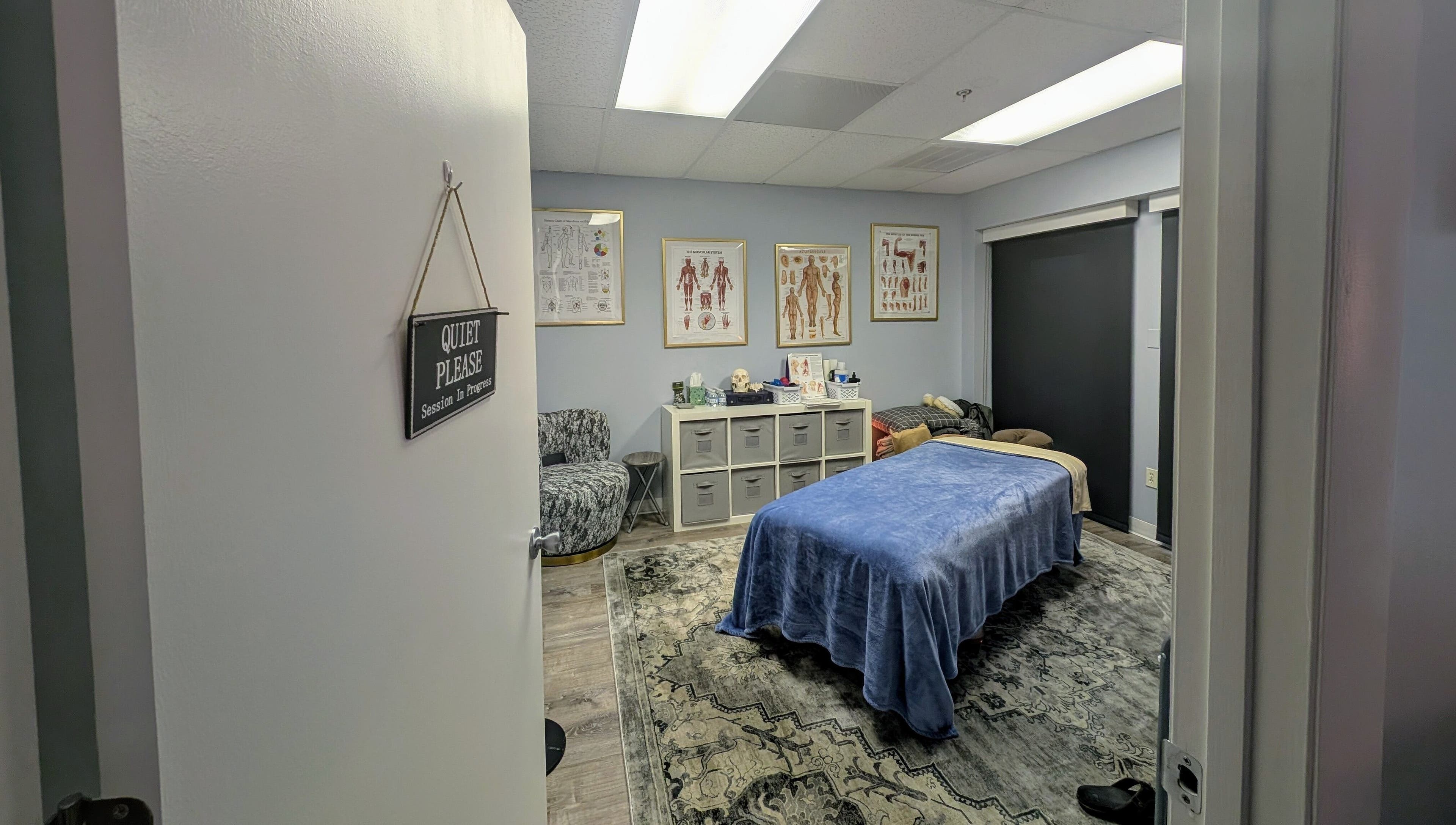 Relaxing therapy room at Naples Healing Arts in Naples, Florida, US with massage table and calming decor.