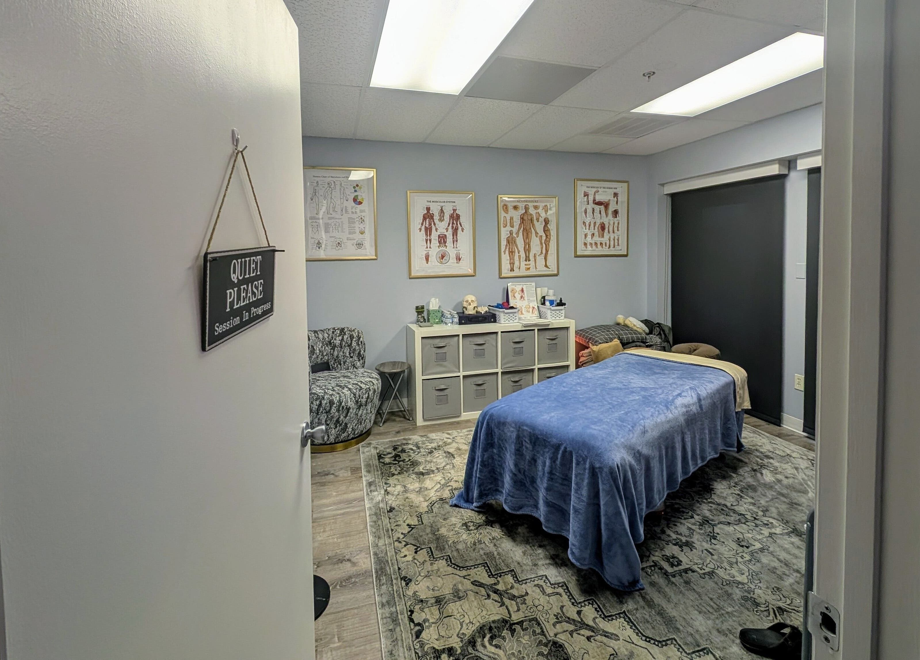 Relaxing therapy room at Naples Healing Arts in Naples, Florida, US with massage table and calming decor.