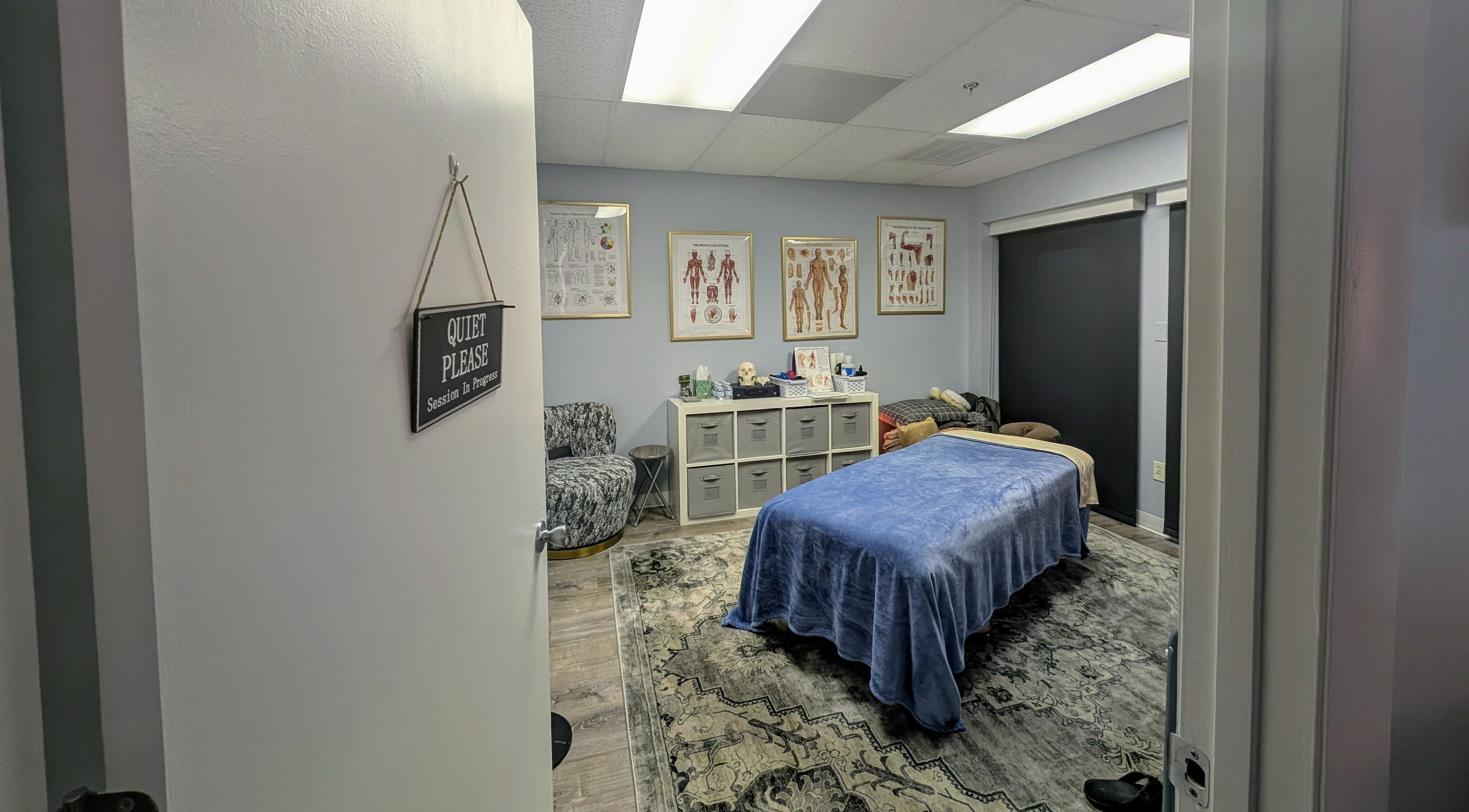 Relaxing therapy room at Naples Healing Arts in Naples, Florida, US with massage table and calming decor.