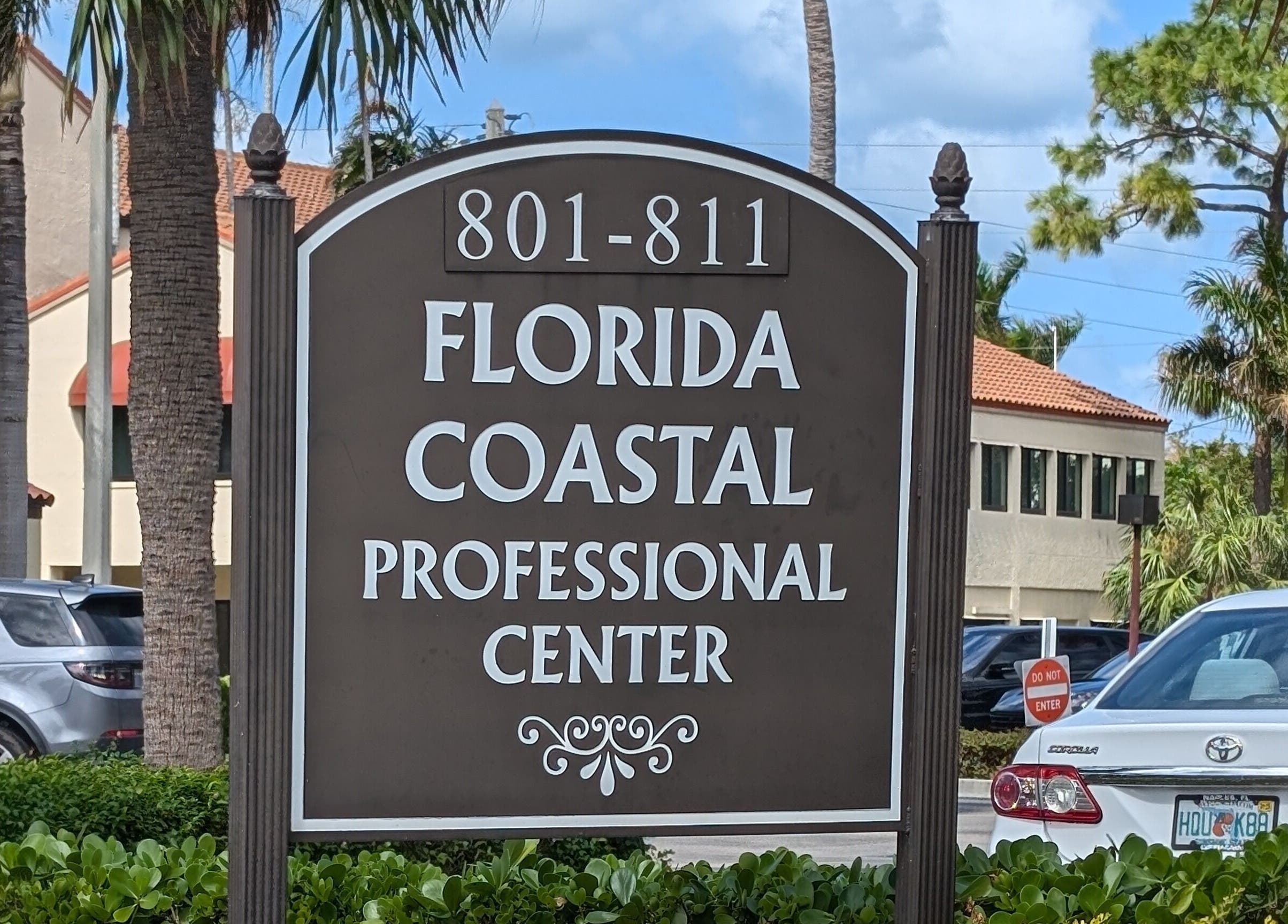 Entrance sign for Florida Coastal Professional Center near Naples Healing Arts in Naples, Florida, US.