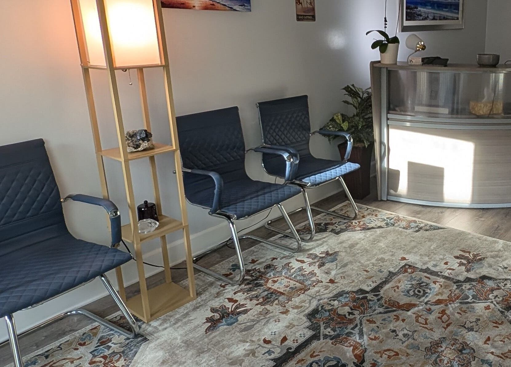 Cozy reception area with blue chairs at Naples Healing Arts, Naples, Florida, US.