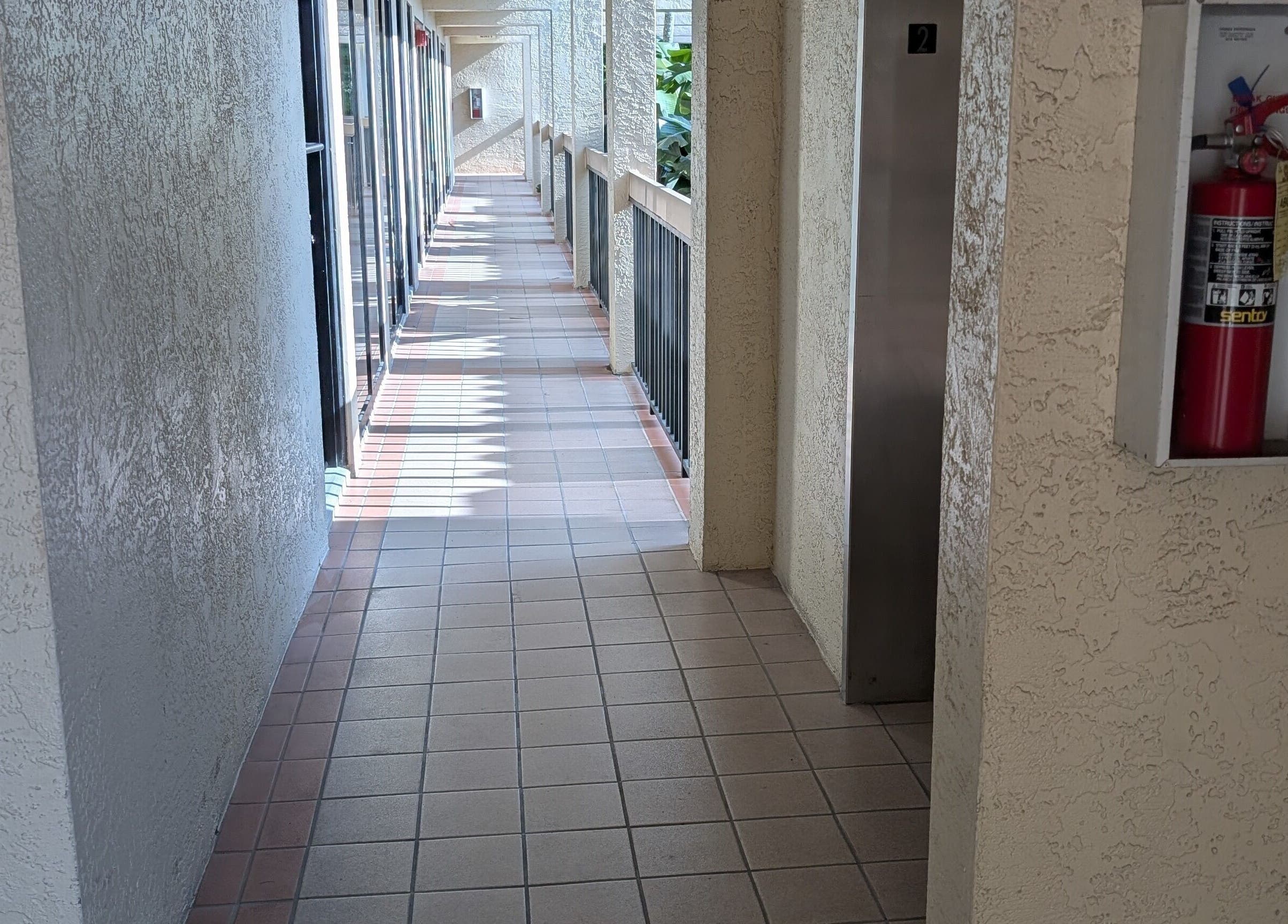 A serene corridor at Naples Healing Arts, Naples, Florida, US, leading to wellness services.